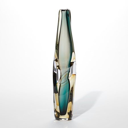 tall transparent vase with fluid lines slightly twisting form and narrow top opening with inner layer in sea green then soft light amber and finally a layer of clear hand made from glass